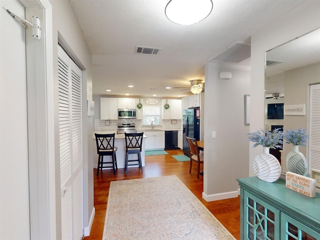 interior space featuring dark hardwood / wood-style flooring and sink