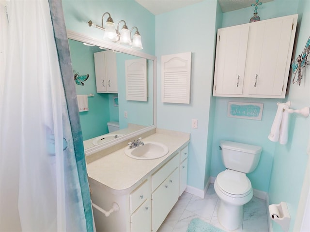 bathroom with vanity and toilet