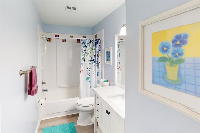 full bathroom with vanity, wood-type flooring, toilet, and shower / bath combo with shower curtain