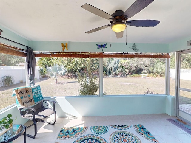 sunroom / solarium featuring a wealth of natural light and ceiling fan