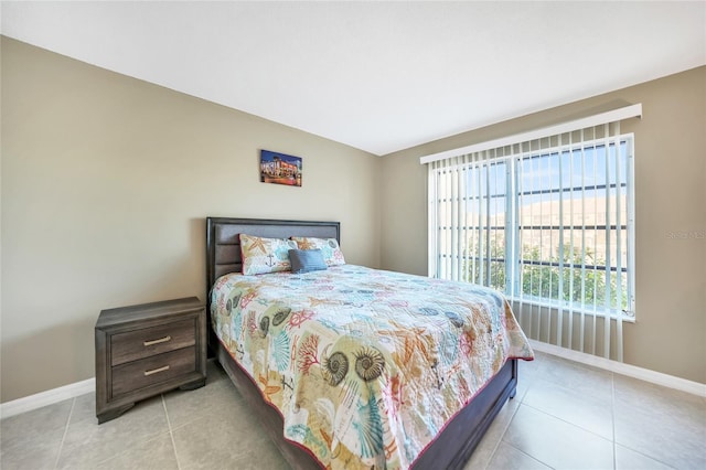 bedroom featuring light tile patterned flooring