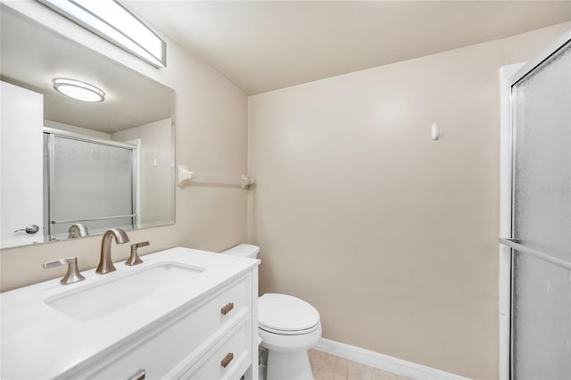 bathroom with vanity, toilet, and walk in shower