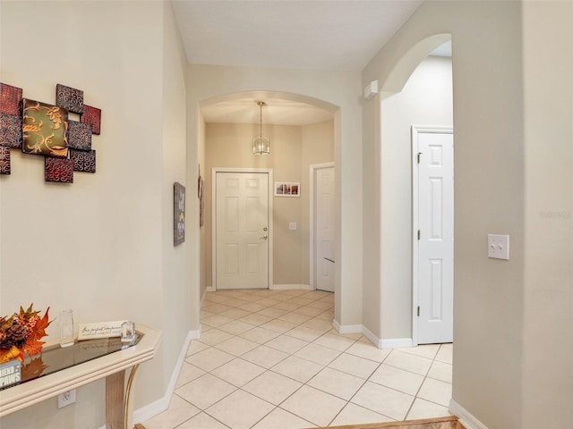 corridor with light tile patterned floors