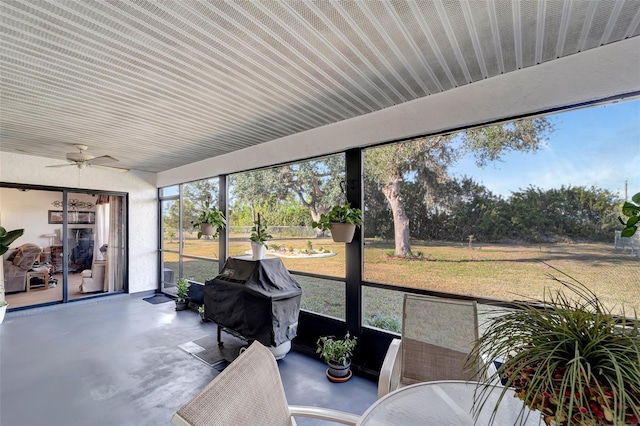 sunroom featuring ceiling fan