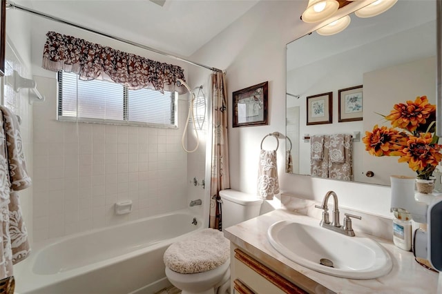 full bathroom featuring shower / tub combo, vanity, and toilet