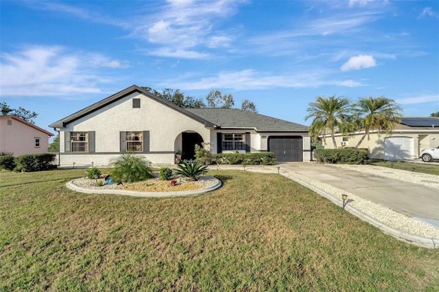 single story home with a garage and a front lawn