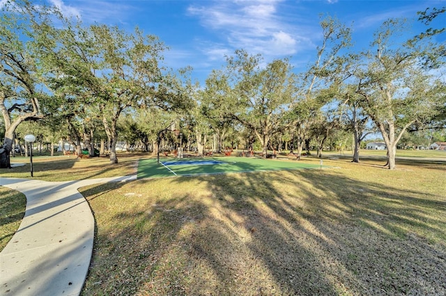 view of home's community featuring a lawn