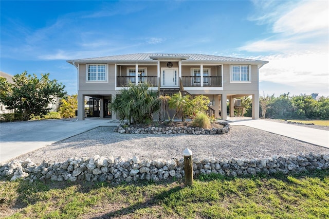 view of front of home featuring a carport and covered porch