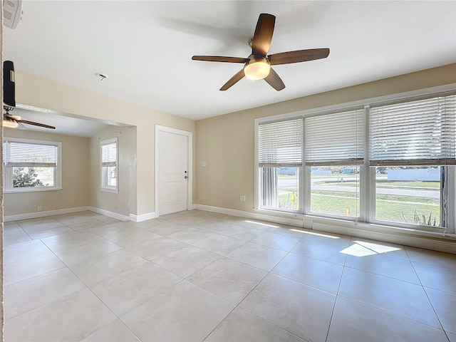 unfurnished room featuring light tile patterned floors