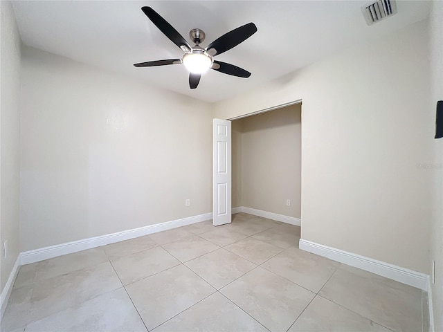 unfurnished bedroom featuring ceiling fan and light tile patterned floors