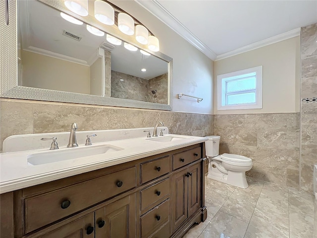 bathroom with tile walls, vanity, ornamental molding, a shower, and toilet