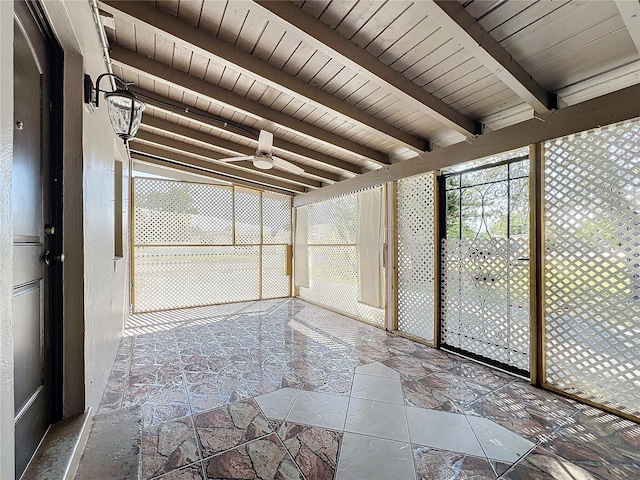 unfurnished sunroom featuring beam ceiling, wooden ceiling, and ceiling fan