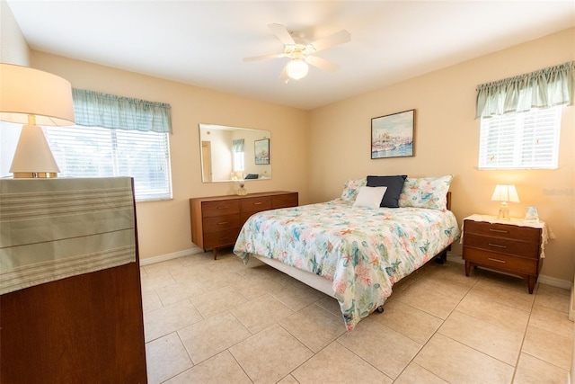 tiled bedroom with ceiling fan