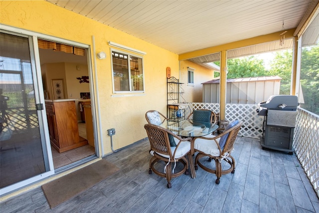 sunroom / solarium featuring wooden ceiling