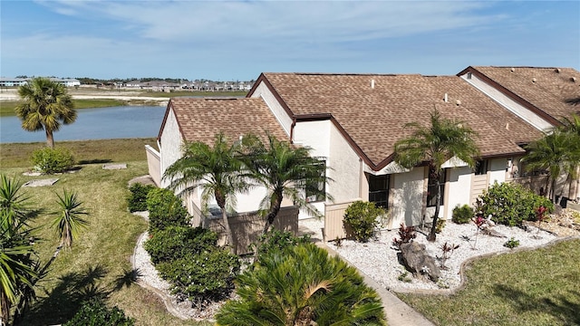 bird's eye view with a water view