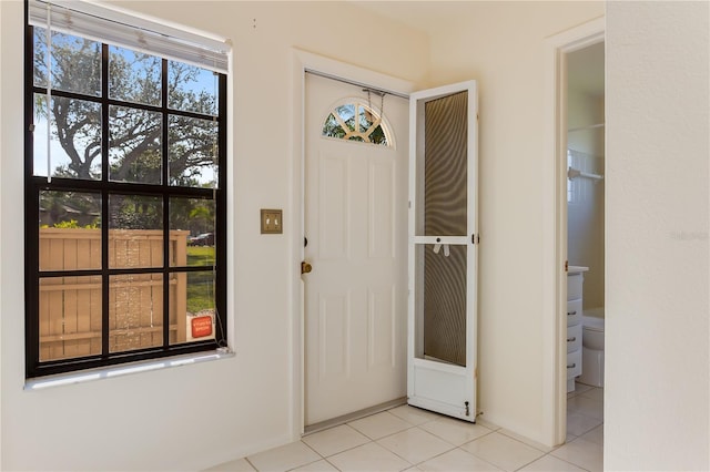 entrance foyer with light tile patterned flooring