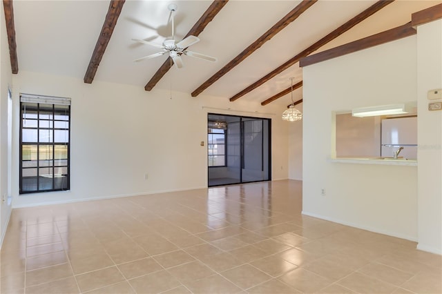 tiled spare room featuring vaulted ceiling with beams, sink, and ceiling fan