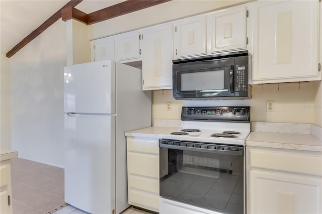 kitchen featuring electric stove, white cabinetry, and white refrigerator