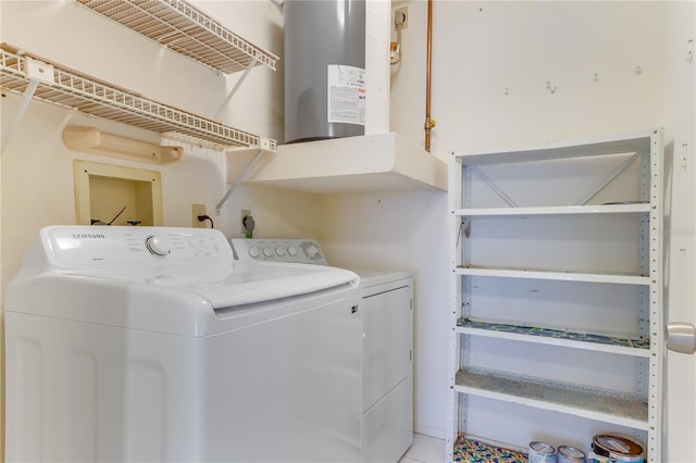 clothes washing area with washer and dryer