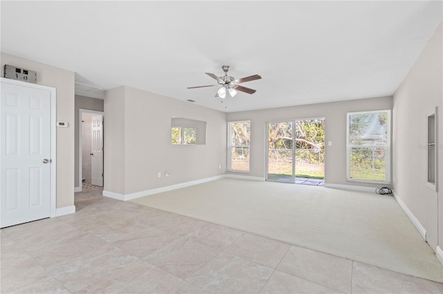 carpeted empty room with ceiling fan