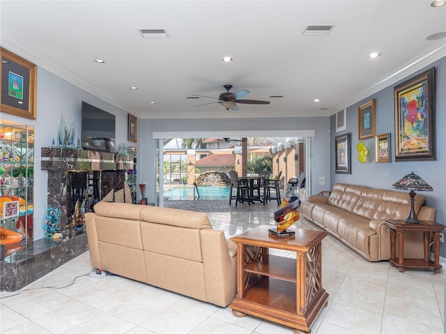 tiled living room featuring crown molding and ceiling fan