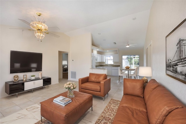 living room featuring vaulted ceiling and ceiling fan