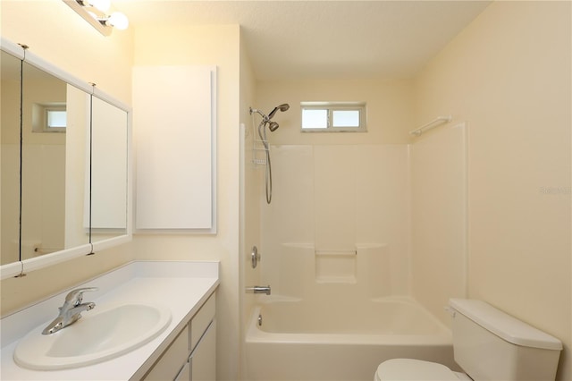 full bathroom featuring vanity, bathing tub / shower combination, and toilet