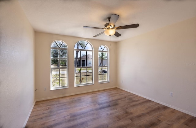 unfurnished room featuring ceiling fan and wood-type flooring