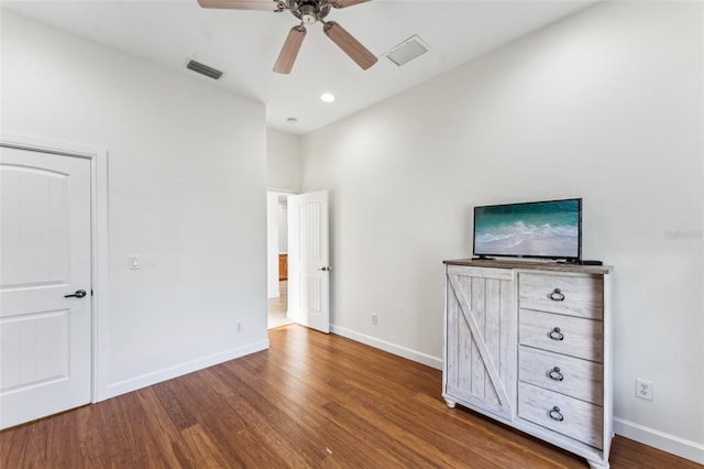 unfurnished bedroom with hardwood / wood-style floors and ceiling fan