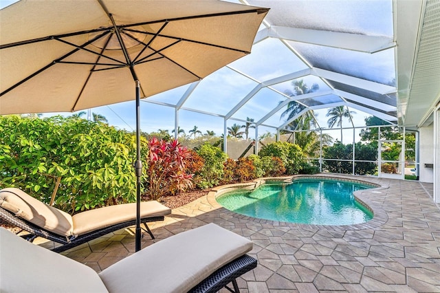 view of pool featuring a patio and glass enclosure