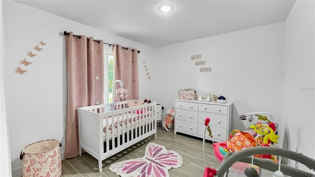 bedroom featuring a crib