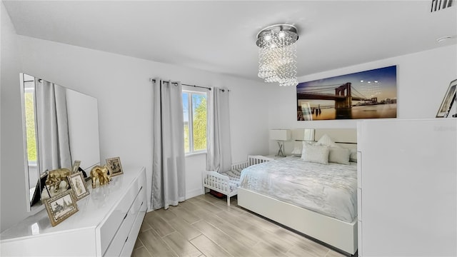 bedroom with a notable chandelier