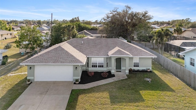 view of front of property featuring a garage and a front yard