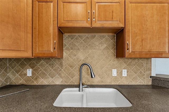 kitchen with sink and decorative backsplash