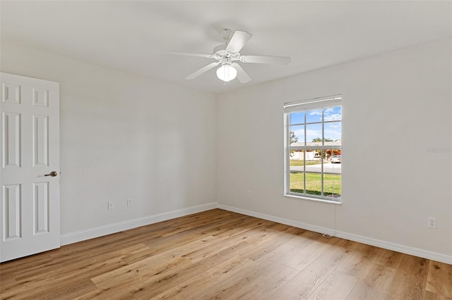 empty room with ceiling fan and light wood-type flooring