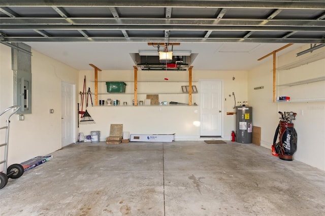 garage with a garage door opener, electric water heater, and electric panel