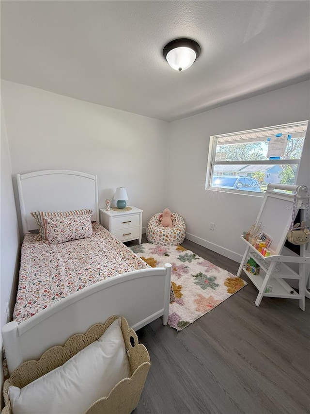 4128 Durant St, Port Charlotte, FL 33948 - bedroom featuring dark wood-type flooring and baseboards