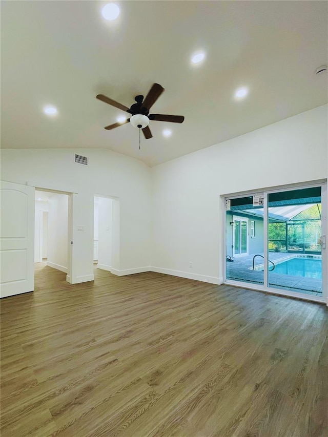 4128 Durant St, Port Charlotte, FL 33948 - empty room featuring a ceiling fan, wood finished floors, vaulted ceiling, and recessed lighting