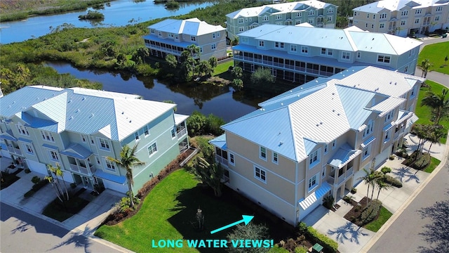 drone / aerial view with a water view