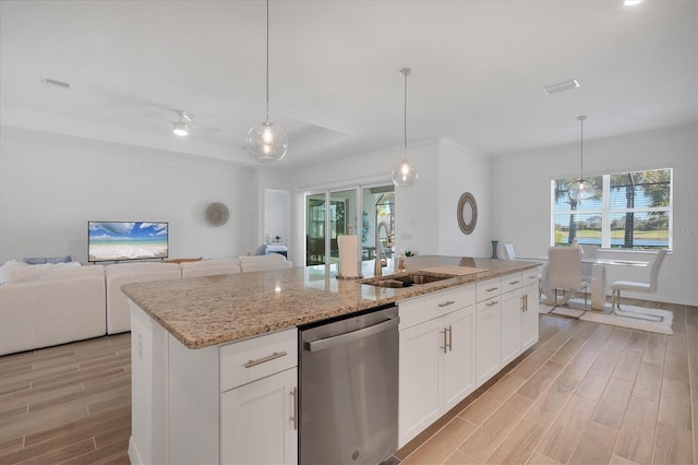 kitchen featuring white cabinetry, dishwasher, and decorative light fixtures