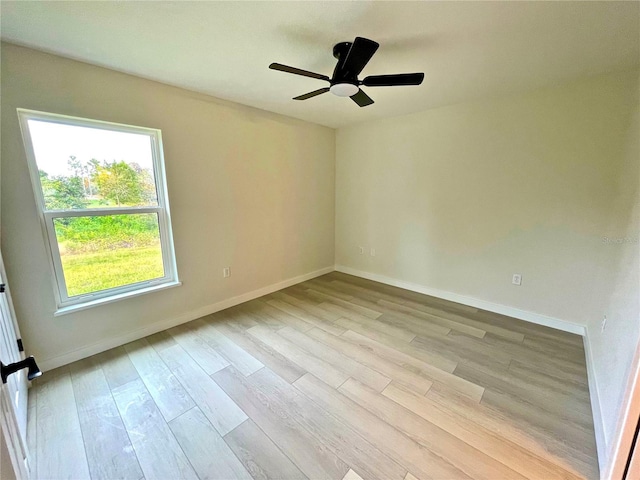 spare room with ceiling fan and light hardwood / wood-style flooring