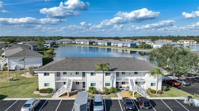 birds eye view of property with a water view