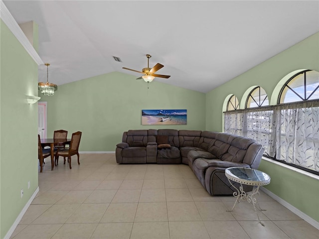 living room featuring ceiling fan with notable chandelier, lofted ceiling, and light tile patterned floors