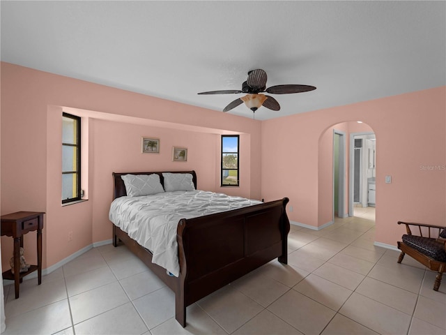 tiled bedroom with ceiling fan