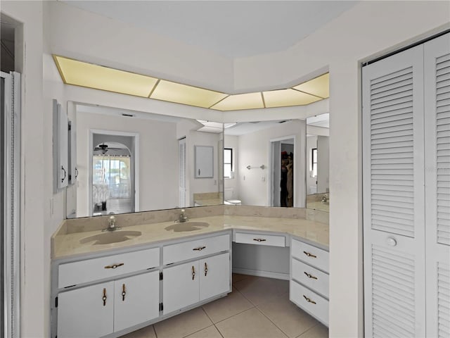 bathroom featuring tile patterned flooring, vanity, and plenty of natural light