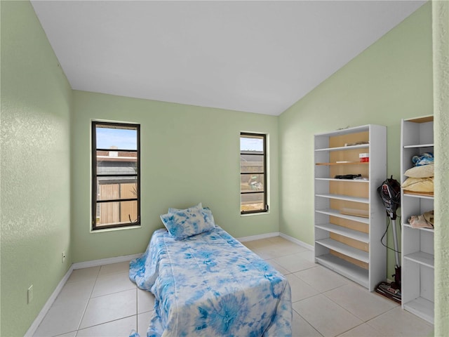 tiled bedroom with vaulted ceiling