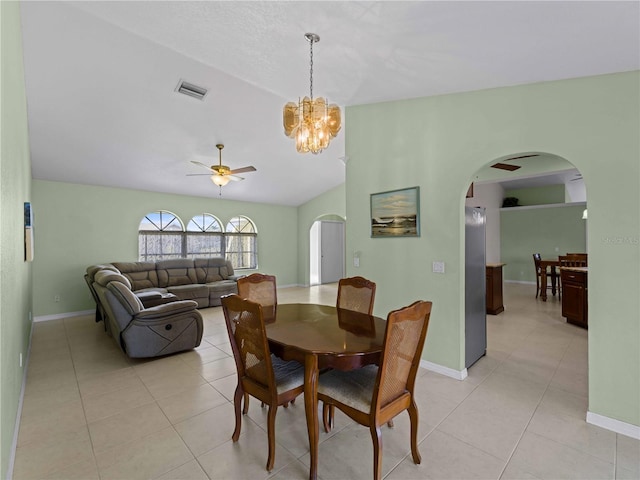 dining area featuring light tile patterned floors, vaulted ceiling, and ceiling fan