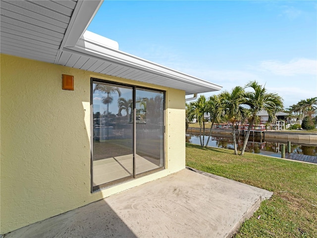 view of patio featuring a water view