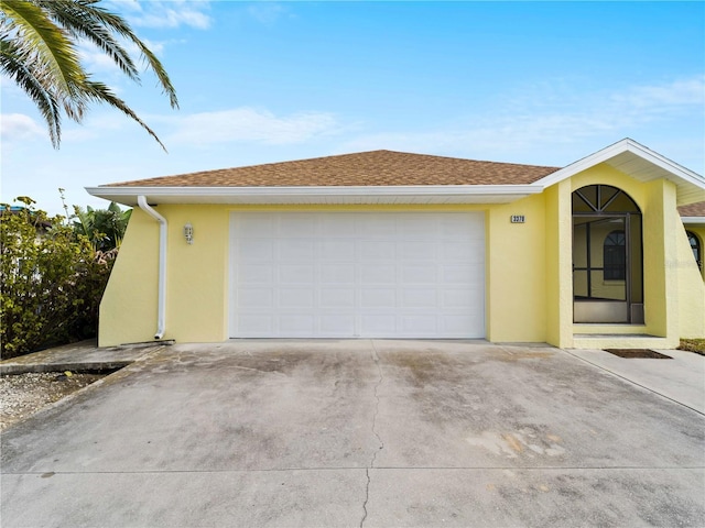 single story home featuring a garage