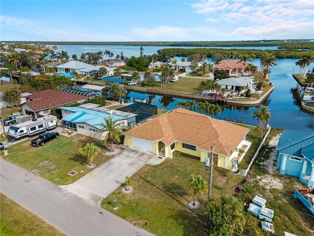 birds eye view of property featuring a water view